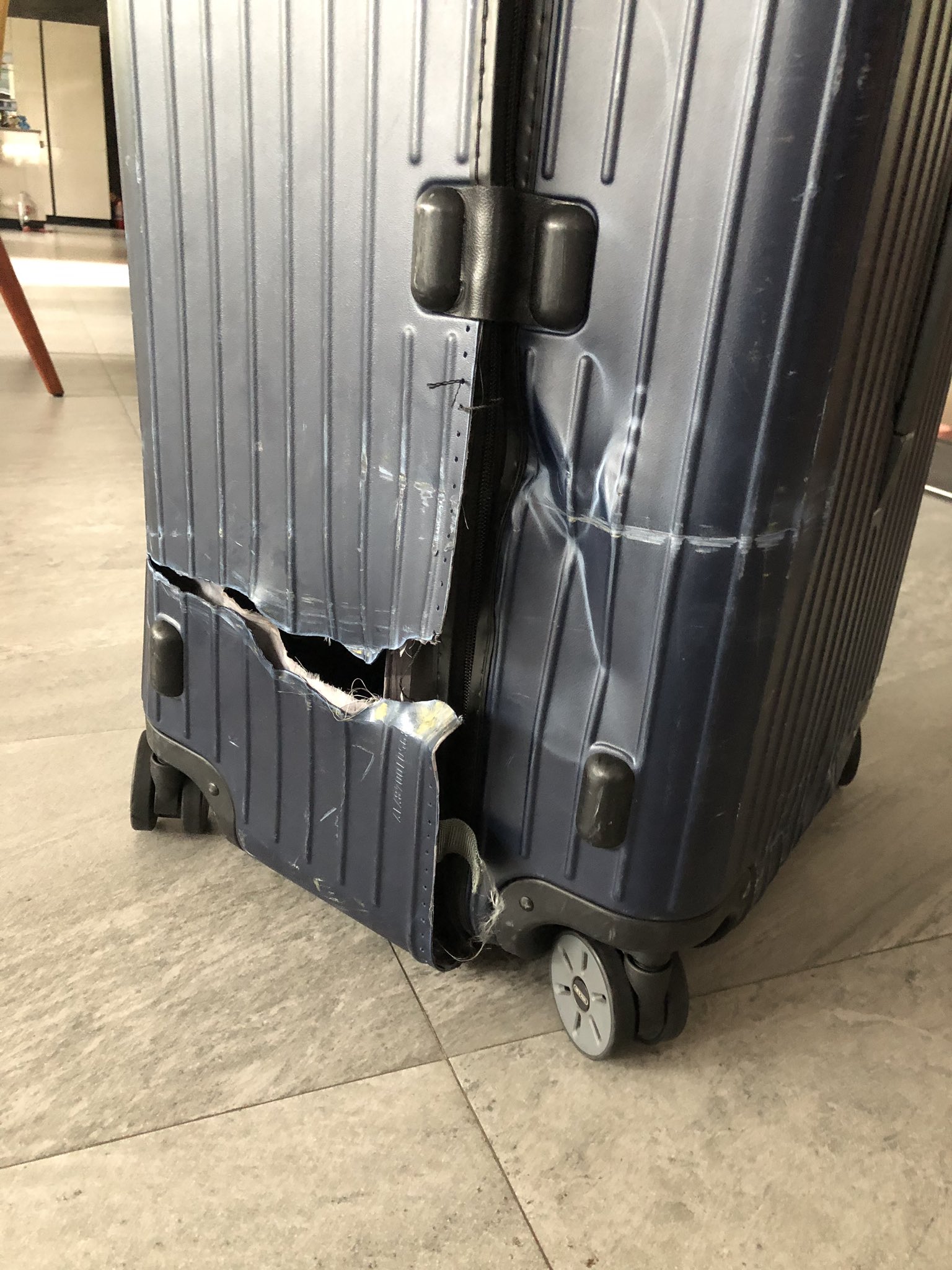 damaged rimowa luggage