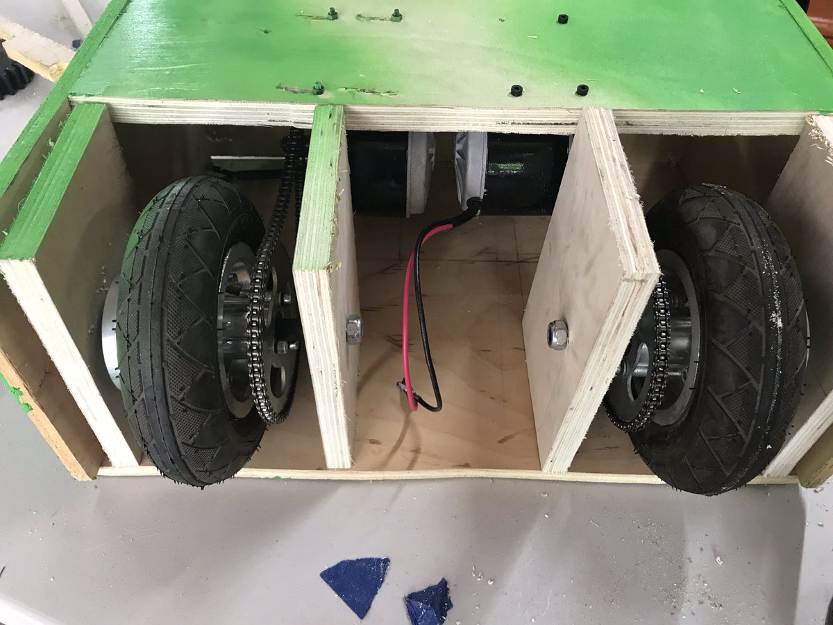 circuitchicken's tweet photo. CREEPER UPDATE: made lots of progress the last few days! Had lots of problems with the stability of the leg with the motors and wheels in it. I am now in the process of integretating metal into the supports to hopefully increase the overall stability. #Minecraft @MkeMakerFaire https://t.co/rxgL7IkJME