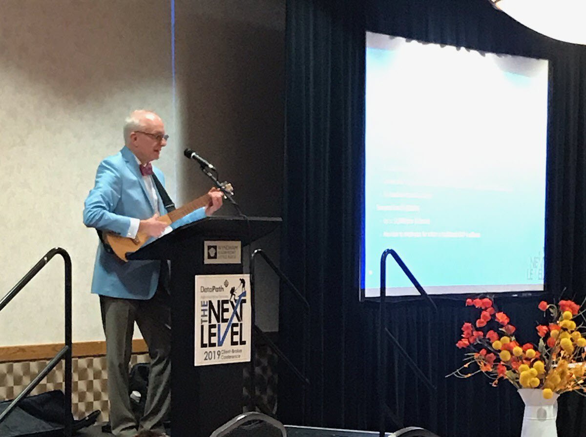 Beneliance's tweet photo. Andy Haynes (a.k.a. "the signing benefits lawyer") has taken the stage to talk and sing about ICHRAs and EBHRAs! #NextLevel2019 https://t.co/dMkXjDtX8V