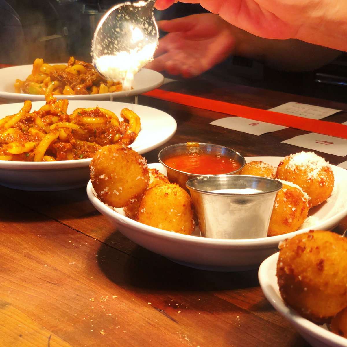 All lined up for lunchtime 🤗🧀 Get in here 🍕🍝🏃🏾‍♀️🏃🏼‍♂️#risottoballs #arancini #nashvilleeats #morecheeseplease