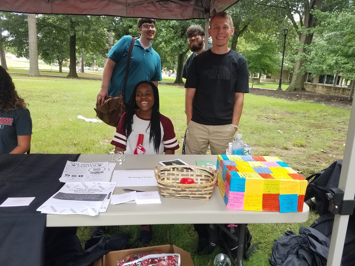 AStateWC's tweet photo. Our tutors are hard at work at Gathering on the Green! Be sure to stop by and grab some Writing Center swag! #wolveswrite #astatewc https://t.co/YXagmweuvG