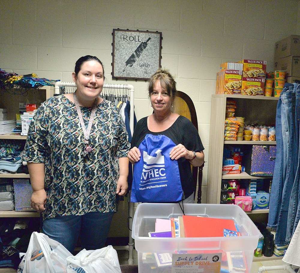 svhed's tweet photo. Dan River Year AmeriCorps Member Rona Collins (right) presents @HCPSDistrict Teacher and Giving Closet Coordinator Victoria Worley with school supply donations for the new Giving Closet. 
A special THANK YOU to everyone who supported the School Supply Drive! https://t.co/M7QDtTyrFT