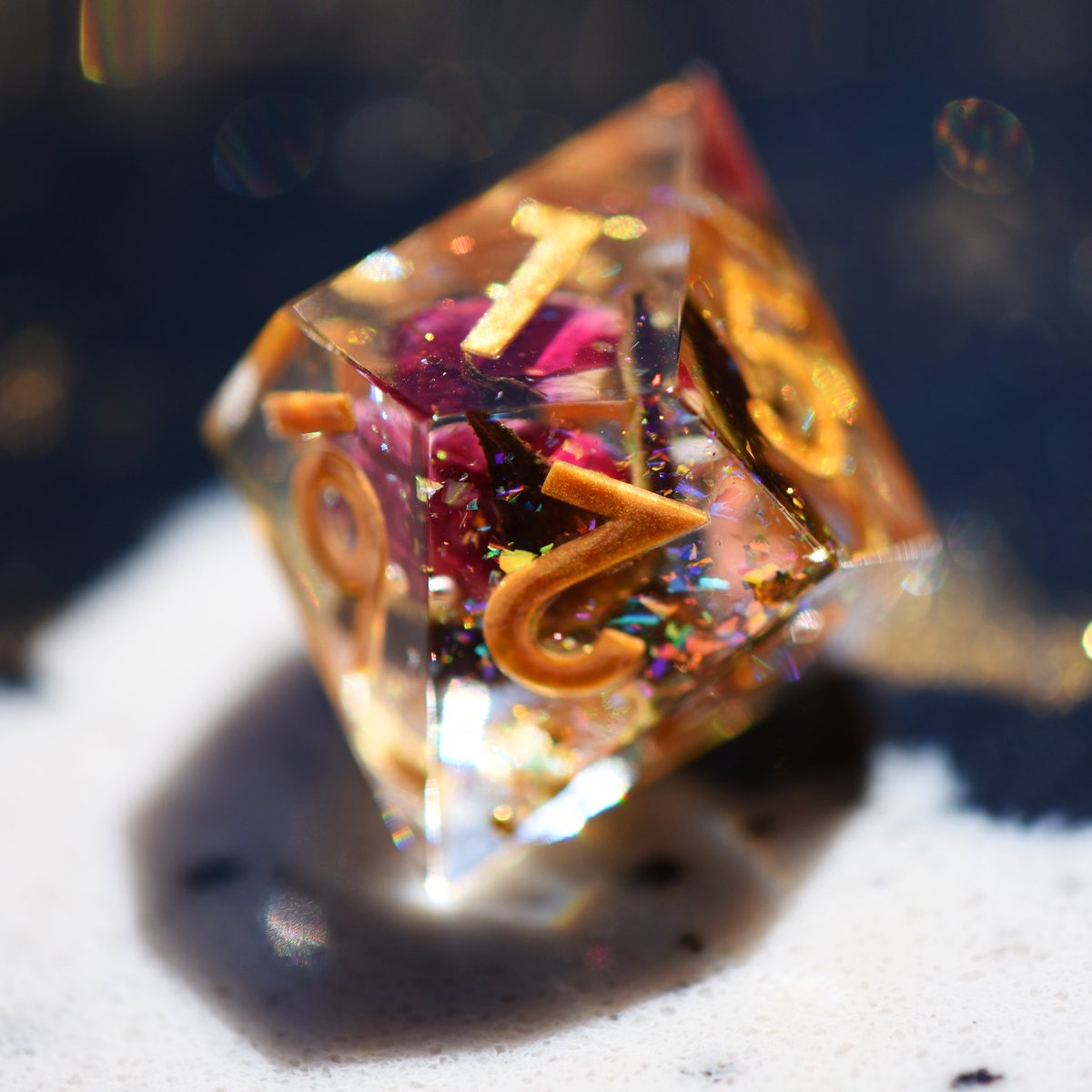dispeldice's tweet photo. Budding roses suspended in a polyhedral dewdrop, w/gold flake & a iridescent prism inside! These are samples from the factory! We have a few problems to solve, but we are SO close. Thank you for all of your love and patience. Updates/FAQ at https://t.co/7ntuGKkOsf, inedible. 🌹✨ https://t.co/haemSfgBik
