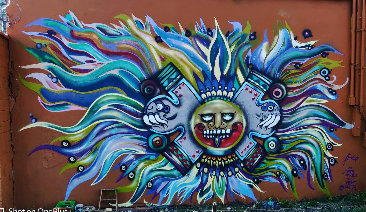 tselone's tweet photo. The huge #AztecSun painted and filled in by the public is complete. View it all of August in #LoganSquare. Design by #tselone, Sponsored by @ChicagoDCASE. #mural, #art, #Chicago https://t.co/EGuQTr6DnA