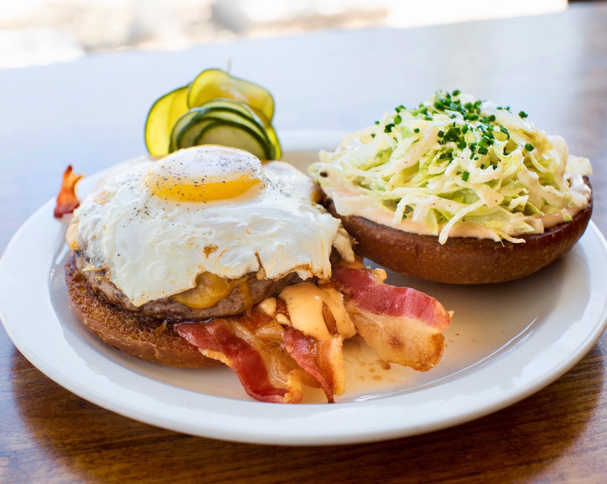 MTOCafe's tweet photo. For National Bacon Lovers Day, try our Hangover Burger served with a healthy portion of bacon, along with a fried over-medium egg, cheddar cheese, lettuce and special sauce on a Hawaiian Bun. You choose the salad or the fries.
#NationalBaconLoversDay https://t.co/xYdYk5niUO