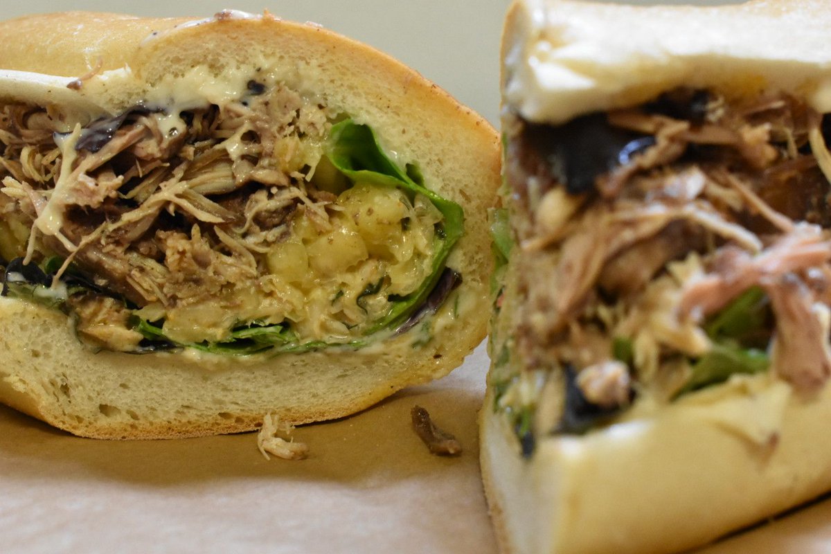Weather not hot enough for you today?  Heat it up even more with our Kingston:  jerk chicken, pineapple salsa, greens, spicy slaw and garlic mayo.