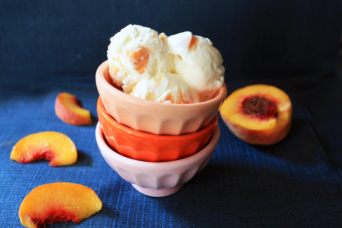Orchard Peach is our signature cream cheese ice cream base with slices of candied peaches. We use fresh local peaches from <a href="/WilklowOrchards/">Wilklow Orchards</a>, then cook them in a sweet simple syrup. Anyone else eat canned peaches as a kid? These are like that, but better!
