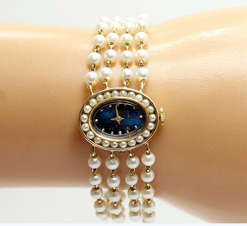 adinajewelers's tweet photo. Absolutely gorgeous! Lucien Piccard pearl bracelet watch in14K yellow gold with blue dial pearl bezel face (19.1GM). At an incredible price, too! Why pay retail? #pearlwatch #womanswatch #lucienpiccard #lucienpiccardwatch #braceletwatch https://t.co/esUSy0dajm https://t.co/unf87AQtSL