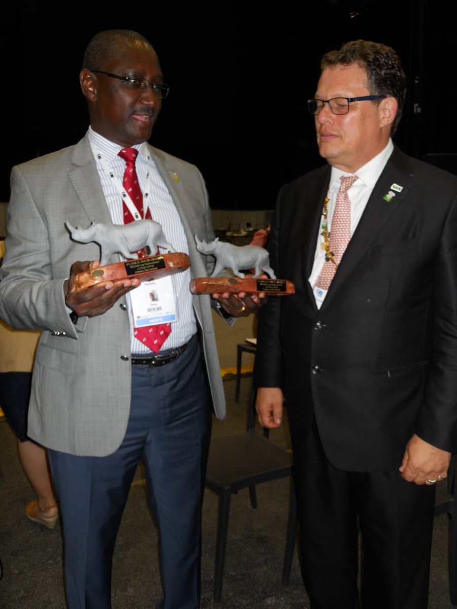 KWSKenya's tweet photo. .@kwskenya DG, Brig. (Rtd) John Waweru accepting awards on behalf of The Late Ag. DG Julius Kimani &amp; Julius Mwandai, (Rtd) SAD,Security who were selected to receive the Clark Bavin Wildlife Law Enforcement Awards on the sidelines of the ongoing CITES #CoP18 in Geneva, Switzerland https://t.co/b39i8rwjG8