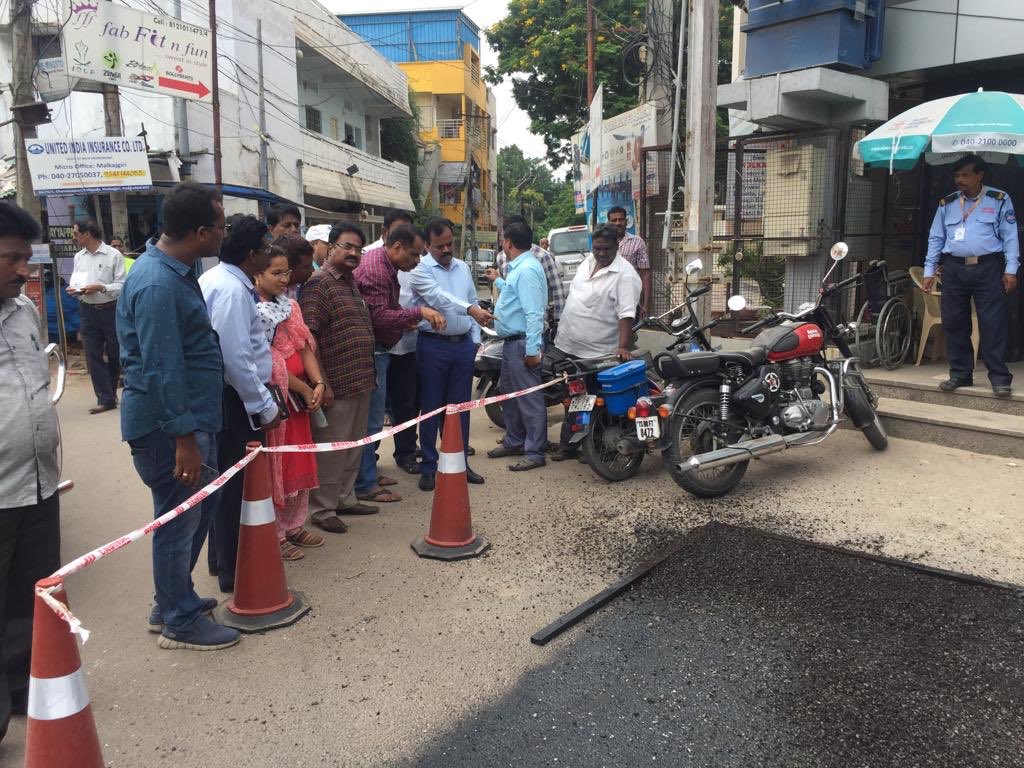 commissioner sir inspecting filling of potholes with Jet patcher on Safil Guda main road Malkajgiri