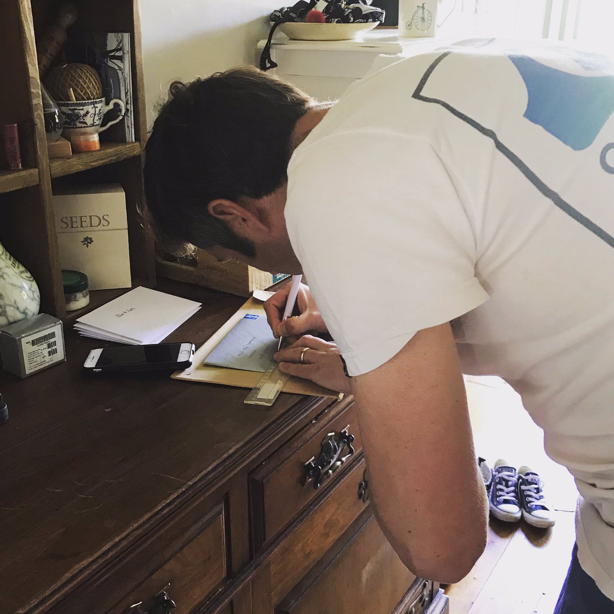 BumblingBilly's tweet photo. Yes, that really is my husband, writing the address on an envelope with a ruler #weirdo https://t.co/I4S3350lJX