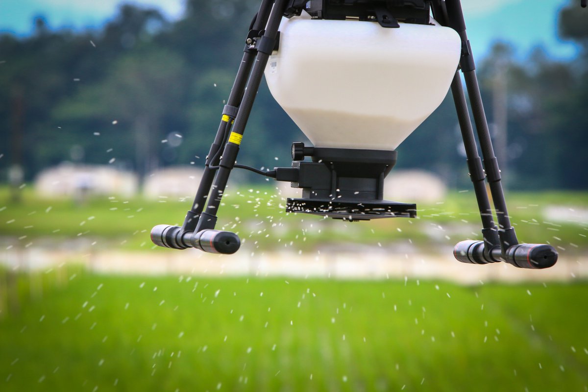 Researchers from the International Rice Research Institute <a href="/irri/">IRRI 🌾</a> in the Philippines using the #DJI MG-Spreading System to do some trials over an experimental field.