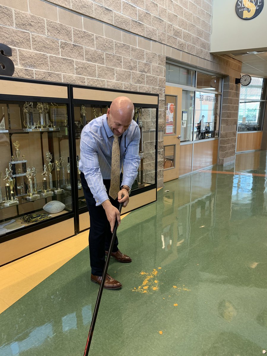 faro_neisd's tweet photo. Walking down the hall and spotted our #principal at work. No job too small! @EricWernli (I cut off the broom head!) #team #rootedlopez https://t.co/uottE8JAgF