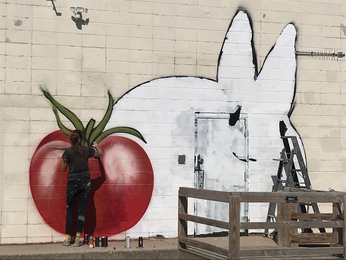 This is happening at the Wire Factory today. Famed graphic artist Jules Muck is making our Winter Market look even more festive!