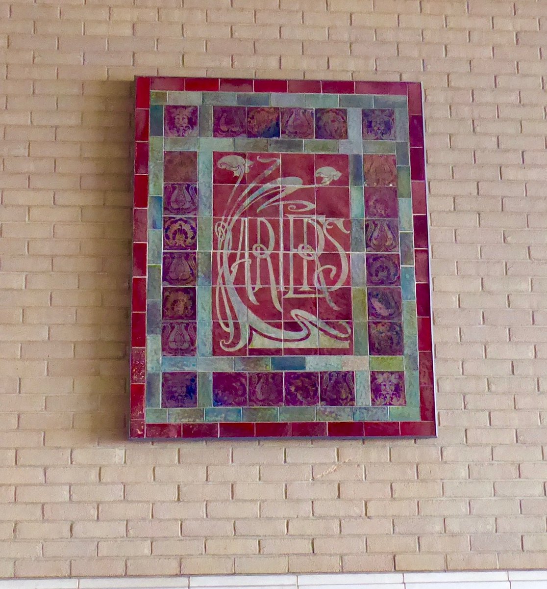 Portaspeciosa's tweet photo. A superb early C20 lustre wear plaque now rather lost on a wall in the half deserted Quay development in Poole; the site of the former Poole Pottery. In the corner there's a little foliate style head. https://t.co/HsZGGPCQ9t