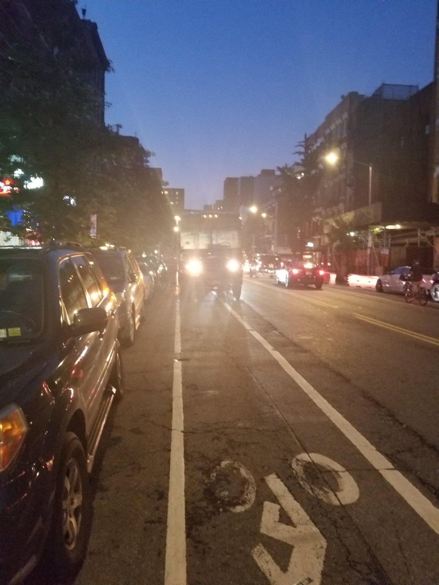 TavidDaylor's tweet photo. @NYPDTransit @UPS Is it permissible to park 3 trucks in a bike lane?  What if you obscure your license plate while doing it? https://t.co/mbv0BznwqI