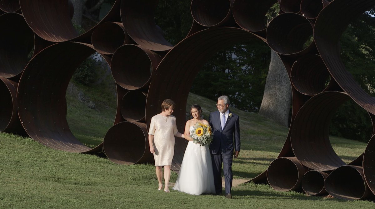 Here comes the bride, Rachael with her parents as she walks to Jason under the Chuppah. 💕#videostill #herecomesthebride #MAWedding #museumwedding #heirloompictures  #MAweddingvideo #MAweddingvideography #MAweddingvideographer #bostonweddingvideographer #mazeltov #weddingvideos