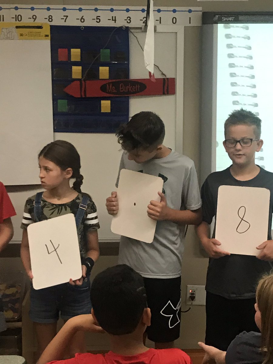 MsBurkett5th's tweet photo. Comparing decimals and wiggling around the room while we do it. #LL5th https://t.co/iZIpJmKhgY