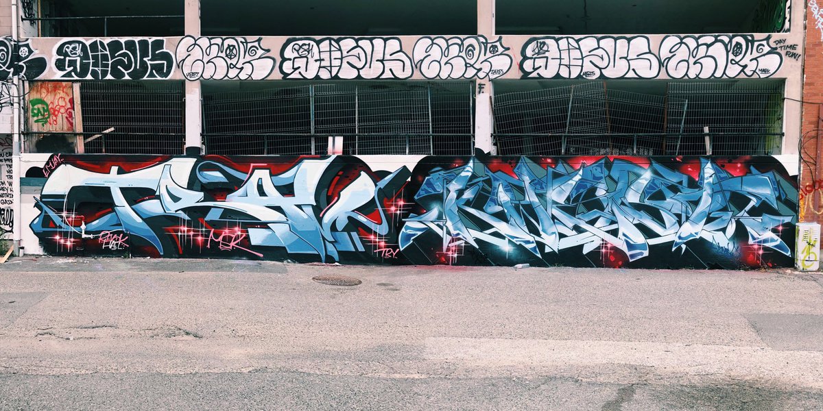 UpHere's tweet photo. Up Here artists #TRAVMSK and #KWEST hit up the legal graffiti wall in the middle of the festival this weekend to do these stunning burners. #uphere5 #weliveuphere https://t.co/NakQiMuPam