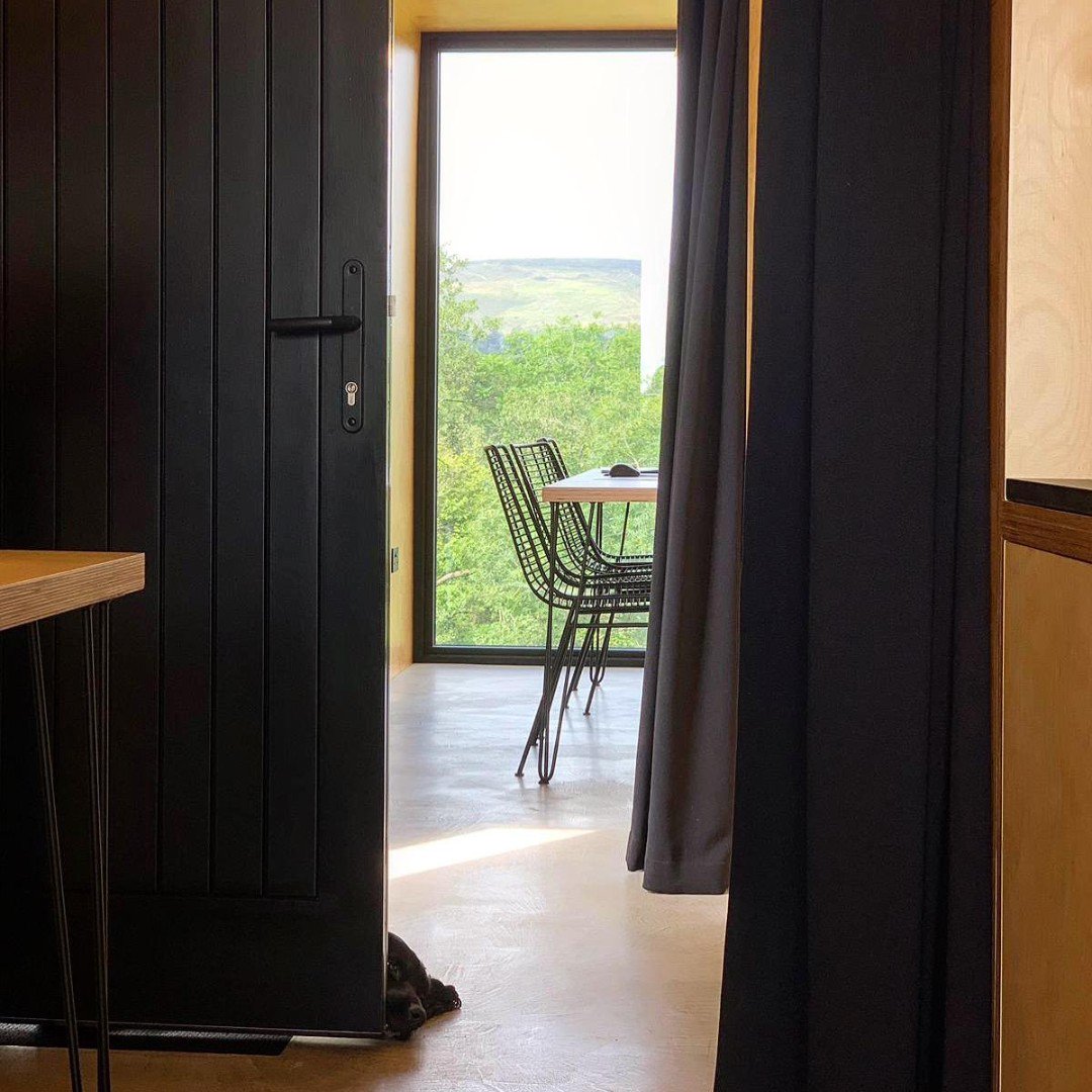 ArchitectsPB's tweet photo. Someone turned up early for work this morning - who can spot him or is he too camouflaged?
.
.
.
#dogsofinstagram #pete #cockerspaniel #black #interiordesign #architectstudio #shippingcontainer #birchply #concretefloor #ruralarchitecture #nature #drumnaph #woodlandtrust #ancarn https://t.co/Hb2llfFT3p