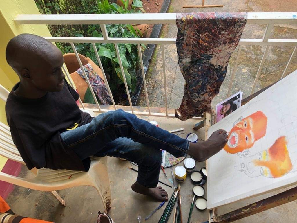 IsaacsKhedive01's tweet photo. How many retweets for this boy Opi from kyambogo university, no arms but to him, disability is not an inability. https://t.co/wjW8TQjdhQ