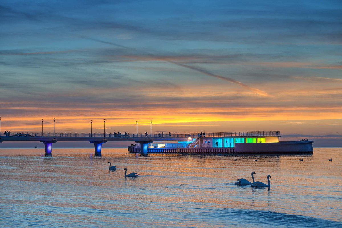 iGuzzini's tweet photo. #Linealuce luminaires light up the pier in Kołobrzeg, Poland. Combined with the luminous games, the infrastructure has now become a landmark you can’t miss! Discover how to give a distinctive face to architecture with Linealuce Compact 75 RGB> https://t.co/BTPtDq3vsG https://t.co/I0MTid4ooj