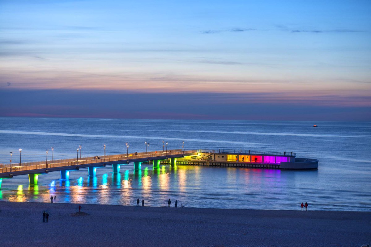 iGuzzini's tweet photo. #Linealuce luminaires light up the pier in Kołobrzeg, Poland. Combined with the luminous games, the infrastructure has now become a landmark you can’t miss! Discover how to give a distinctive face to architecture with Linealuce Compact 75 RGB> https://t.co/BTPtDq3vsG https://t.co/I0MTid4ooj