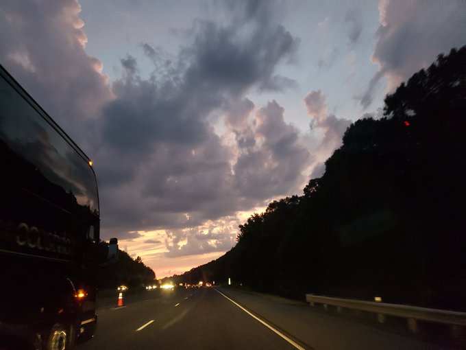 There in the distance, in the cloud formation is a flat boat with multiple sails. I dont know the name