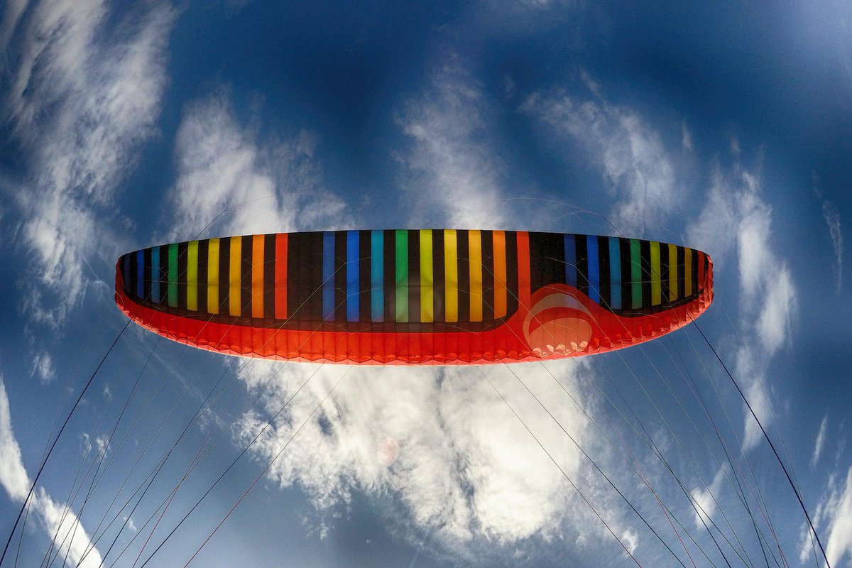 AlpinAir's tweet photo. My paraglider is like a rainbow  in the sky!

#Switzerland #traveling #paragliding #sky #rainbow #fly #BUCKETLIST #interlaken https://t.co/PdUMb8fUU6