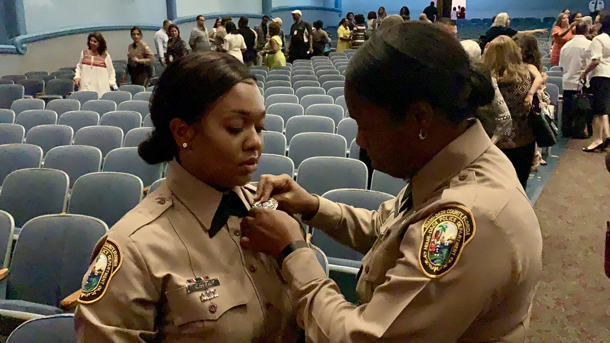 MiamiDade_SO's tweet photo. Celebrating with those that matter most! Moments after being sworn in as #MDPD officers, members of #BLE124 joined their loved ones to celebrate 💙 #MDPDproud https://t.co/QDWVmU3cuN