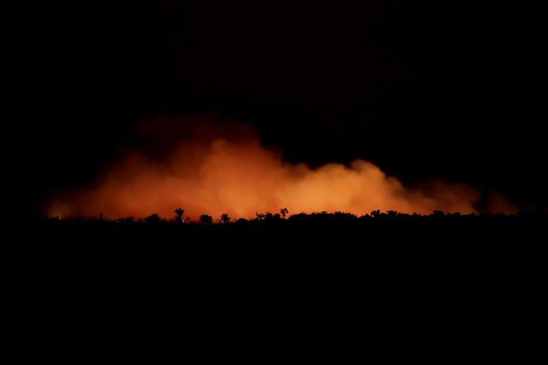 Reuters's tweet photo. As Amazon burns, Brazil's Bolsonaro tells rest of world not to interfere https://t.co/HUpuBQBsmz https://t.co/nMW4LYMhth
