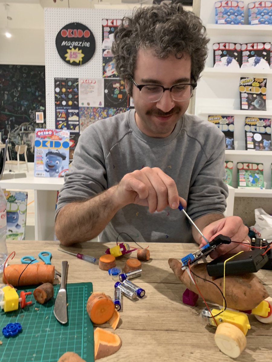rossatkin's tweet photo. We’ve been taking over @okidomagazine’s pop-up in Hammersmith with @CraftyRobot this week. Yesterday I gave a 5 year old participant in #BotatoWars my phone to drive her robot and I just discovered she sneaked this rather nice photo of me whilst I was fixing the wiring. https://t.co/XIqzXtWZKb