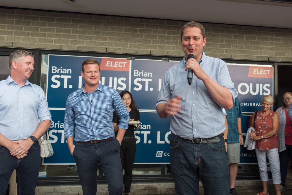 ottawabing's tweet photo. It’s time for Canadians to get ahead instead of barely getting by under Trudeau’s government, @AndrewScheer told a large cheering crowd in front of the newly opened campaign office of Brian St Louis, PC candidate for Nepean. #AndrewScheer @CPC_HQ @BrianForNepean @NepeanTories https://t.co/v7UU7n03yP