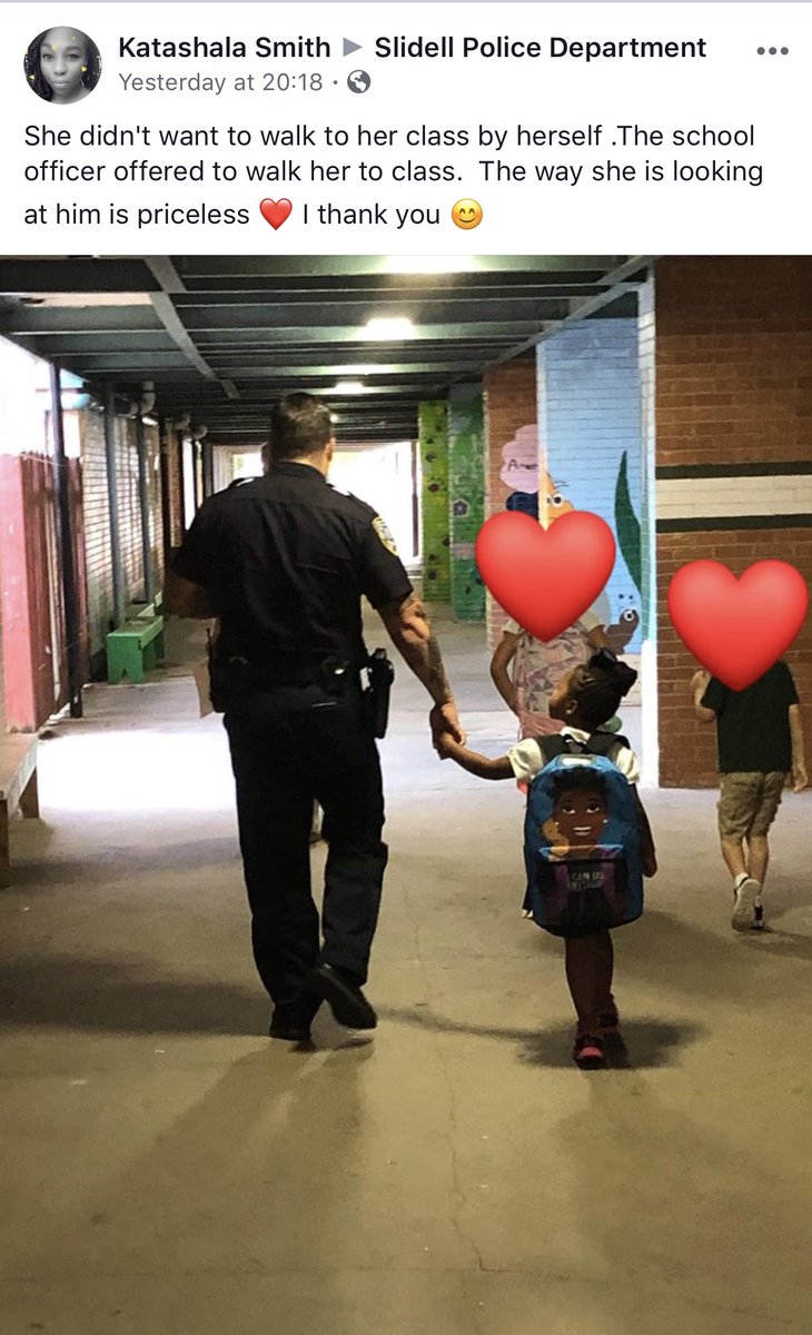 SlidellPD's tweet photo. Another priceless photo. This little girl didn’t want to walk to class by herself, so Slidell Police Officer Brandon Landry comforted her and walked her to class. Thank you Katashala Smith for sharing.👮 https://t.co/C9J5C3ZtKf