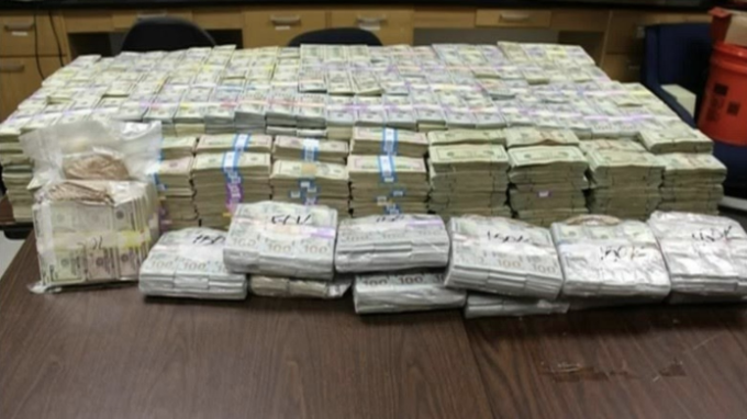 Included in this was a photo of cash - that we traced back to this article  https://www.telegraph.co.uk/news/2016/06/30/staggering-24m-cash-found-hidden-in-secret-room-in-miami-drug-ra/