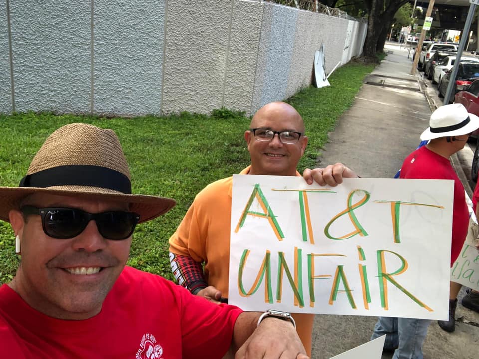 CWAUnion's tweet photo. CWA members in south FL went on strike against AT&amp;T yesterday. They initiated the strike after filing an unfair labor practice charge against AT&amp;T for illegally disciplining members for wearing union memorabilia &amp; for participating in activities that are protected under the NLRA. https://t.co/A7I9Fb11GD