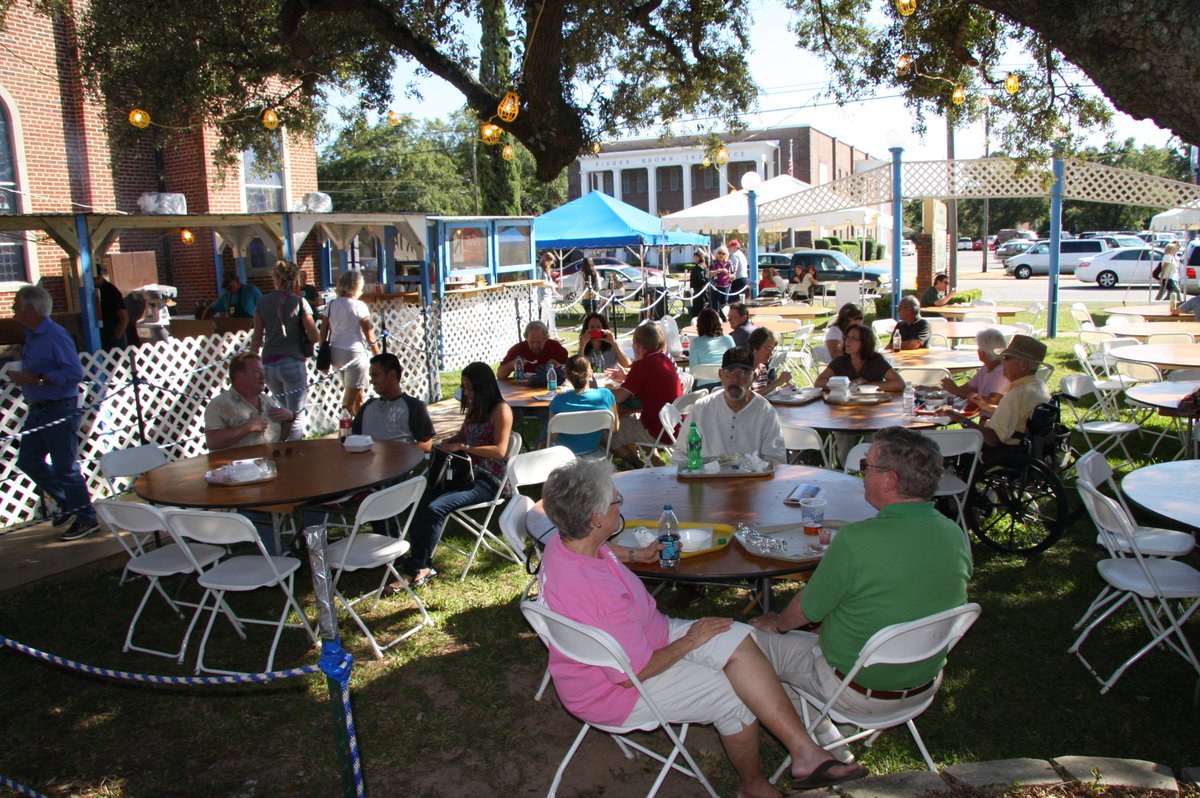 PcolaGreekFest's tweet photo. To enjoy your delicious Greek food, you can find seating under the big tent where you can watch our folk dancers and listen to traditional Greek music. You'll find even more seating in our courtyard where Gyros, slouvaki, and clamari are sold. #PcolaGreekFest #Pensacola https://t.co/FhCrP6Xcy7