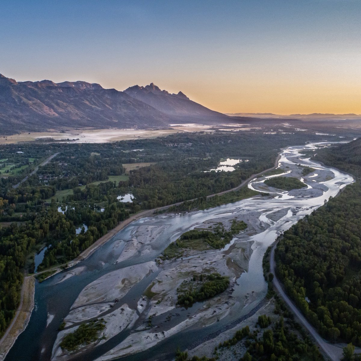 The Tetons wake up to a canvas of colors. #jacksonhole #jhdreaming #tetons