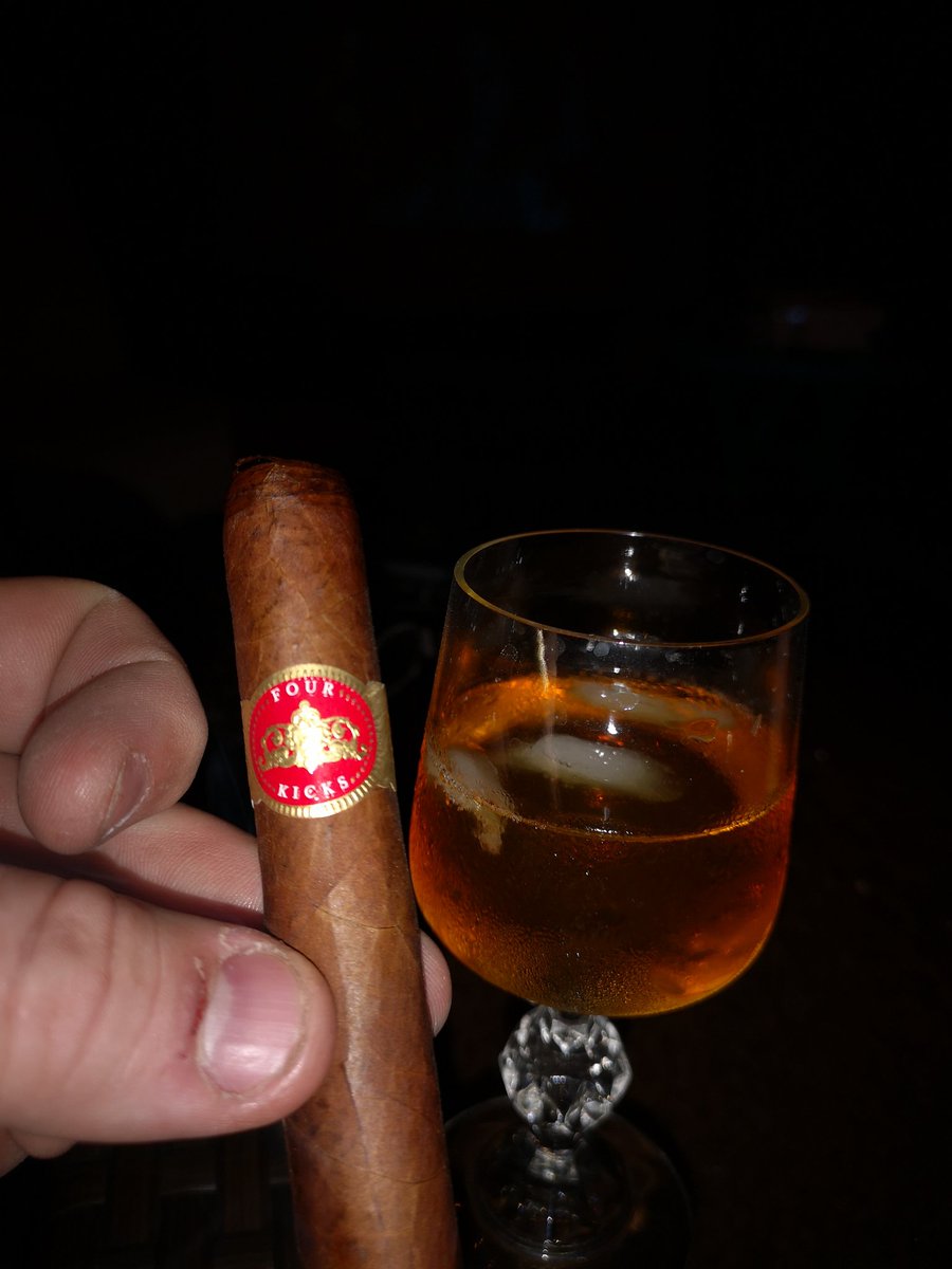 thebighurt70's tweet photo. Friday night bliss. Movie night on the patio. Enjoying this Four Kicks @TheCrownedHeads paired with a glass of Te Bheag whisky and my love. @VillageCigarCo https://t.co/Z8ErnUZWir
