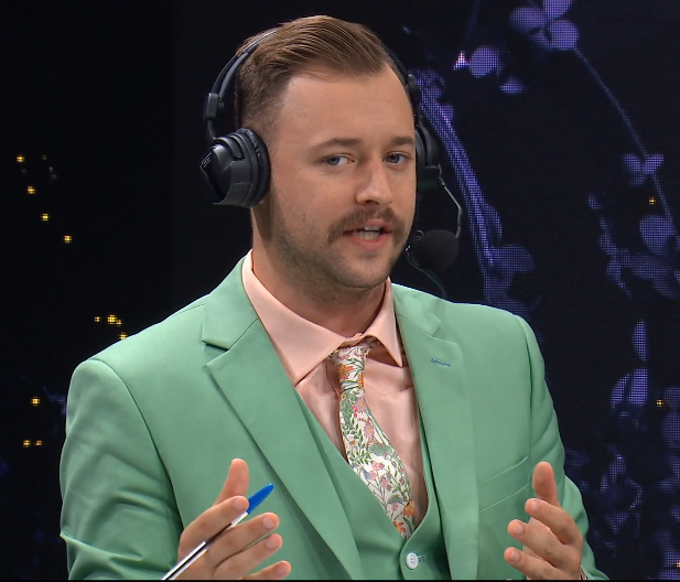 SaltyDigi's tweet photo. That suit. @RichWCampbell looks like a pack of Mentos and its great. He is killing it. 🔥 #TI9 https://t.co/VuMeqmLUgE