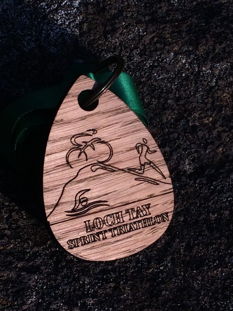 MoiraFin's tweet photo. This time last Saturday I was plunging into the water for @durtyevents Loch Tay Sprint Tri through rain, sun &amp; wind. But a beautiful wooden medal &amp; a podium 1st for my son 🥇 https://t.co/2zRPIDSlKO