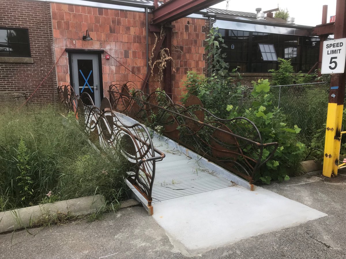 ⁦LOVE <a href="/thesteelyard/">the Steel Yard</a>⁩ new bioretention bridge, connecting to new lobby space! “We’re gonna have to mow this bridge” #lovableinfrastructure #PVD #art