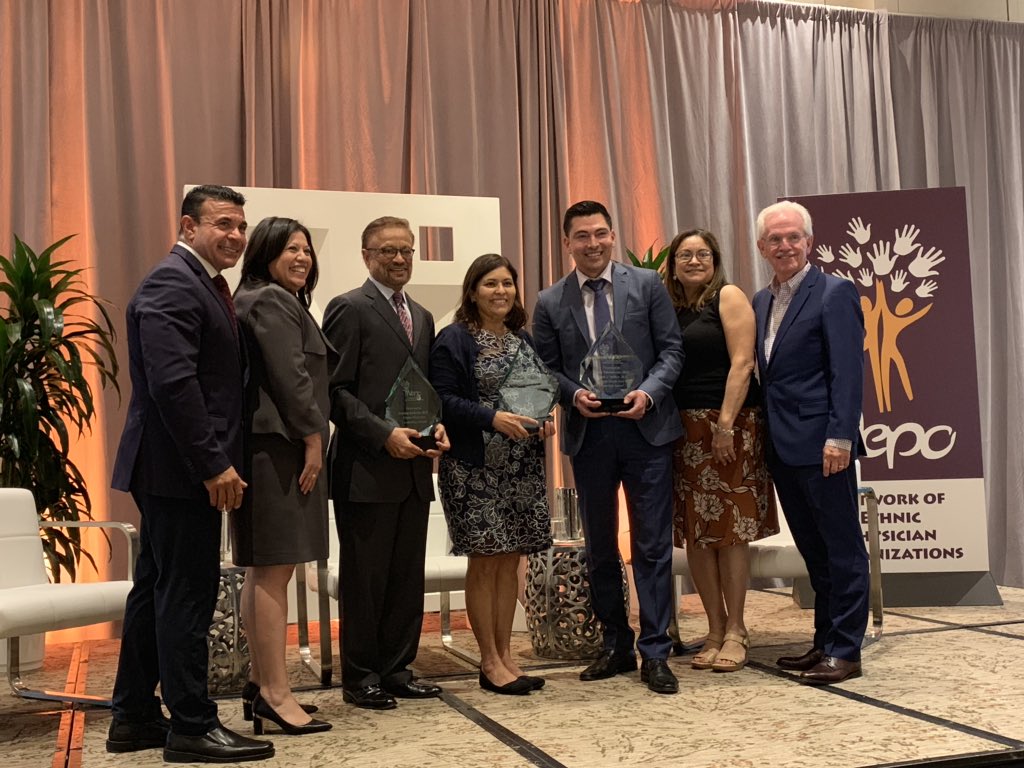 aguilargaxiola's tweet photo. @PHCDocs Board member Nick Macchione presenting the 2019 @ethnicphysician awards to Drs. Efrain Talamantes, Silvia M. Diego and Sudeep Kukreja #NEPOSummit2019. Inspiring words to an attentive audience that celebrated the multiple accomplishments of the awardees! Congratulations! https://t.co/v0OexaQ5n3