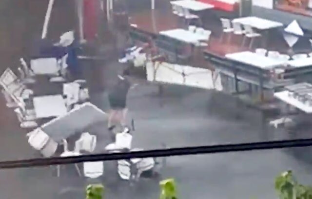 HowesNathan's tweet photo. Caught on cam: Strong winds send @TheEssoClub employee flying onto roof. Employees at @TheEssoClub restaurant across the street were scrambling to secure a large tent that was lifting into the air #SCstorm @SCweather_wx - https://t.co/iUkVoMwFv6 https://t.co/vufCxTjG6J