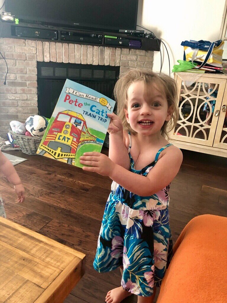 DanielleBreezy's tweet photo. Our niece was so excited about her new book! She love trains just like her grandfather does aka my dad! So sweet! 🚂 https://t.co/ploNB7UoeM