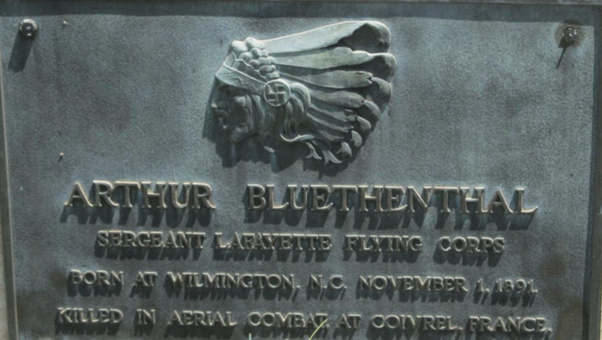 Here's an odd sight - a swastika on a gravestone in a Jewish cemetery. The grave belongs to Arthur Bluethenthal, an American pilot killed flying with a French squadron in WW1. And the swastika is on the headdress of a Native American - the insignia of the Lafayette Escadrille.