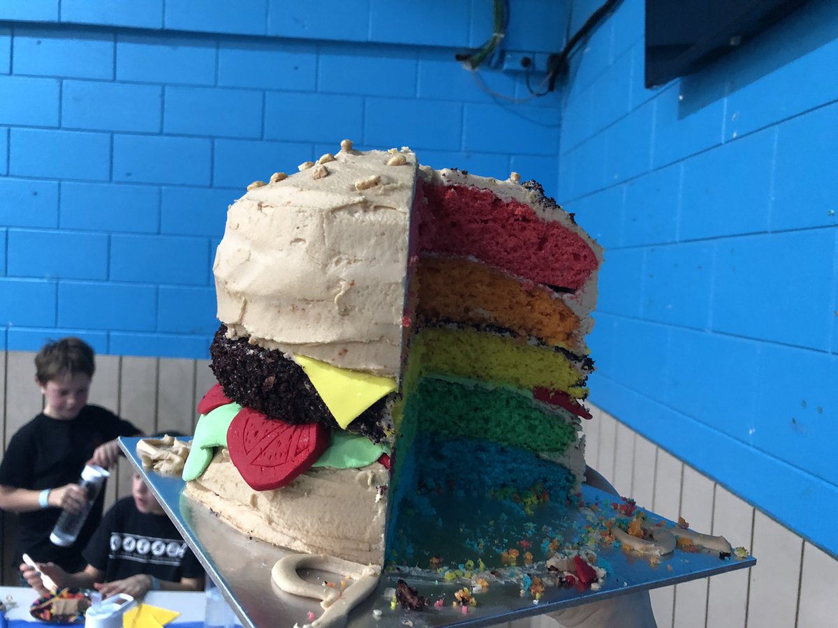 RobertGlancy's tweet photo. Burger cake update. Check out the rainbow inside. Jemma is a genius. Nailed it! https://t.co/CvpHwYeH9e