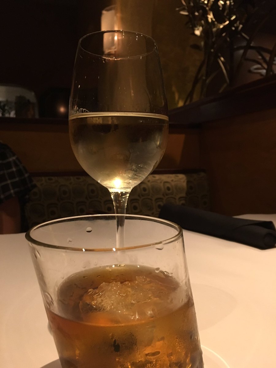JohnGumm's tweet photo. My Old Fashioned appears to have already hit the sauce before it got here. Good thing the Pinot Grigio is still upright. #LeaningtoTheSide https://t.co/vkJCCWAkqs