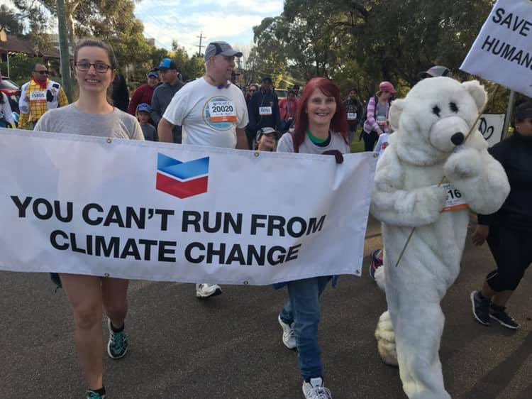 PiersVerstegen's tweet photo. Some truth telling at the #Perthcitytosurf @Chevron is WA’s biggest polluter. We can’t let climate criminals use community events like this to greenwash their brands. Thanks to these amazing people for calling them out. @PerthCitytoSurf @abcperth #wapol https://t.co/POfGWi2g6M