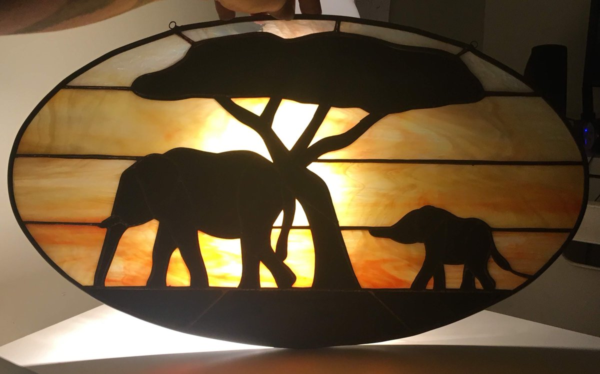 Completely forgot about this #elephantpanel we made! 🐘One of my favourites, especially once it's backlit like it is here. 😍What animal would you like to see as a #stainedglass panel? #stainedglassartist #africanelephants  #originaldesign #africanlandscape #africansunset